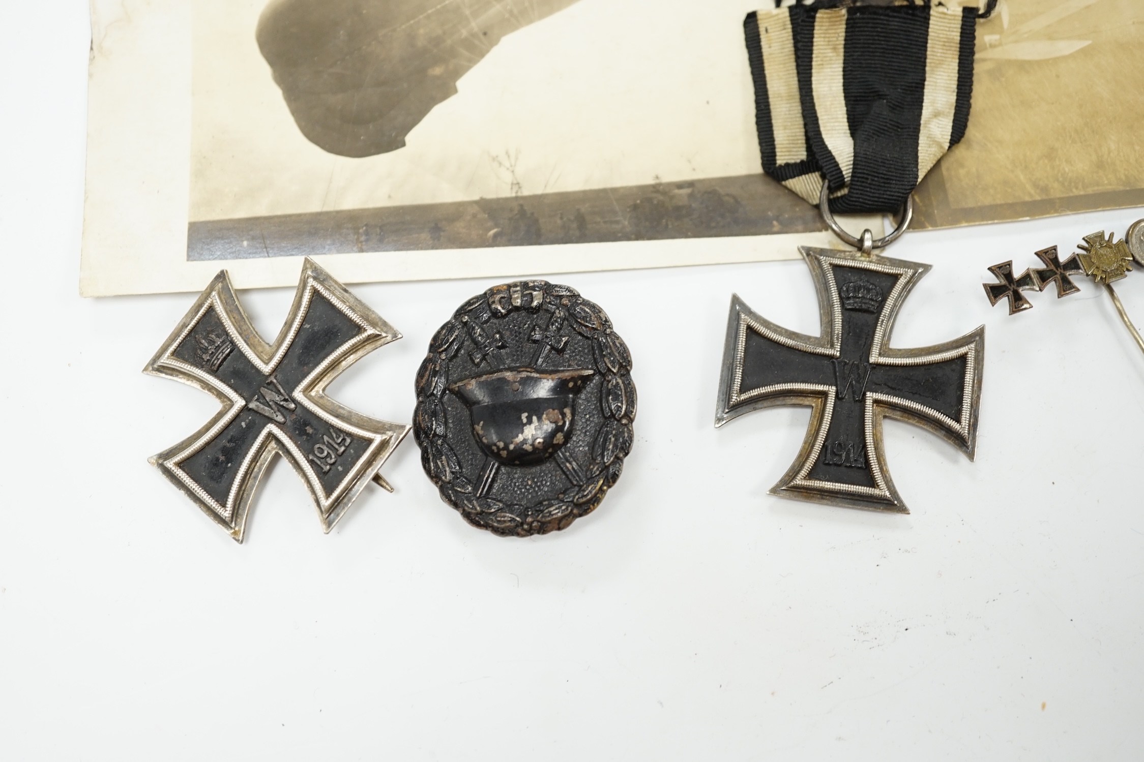Four First World War German medals; a First Class Iron Cross, a 2nd Class Iron Cross, a 1914-1918 Honour Cross and an Austro-Hungarian Medal for Bravery, together with a wound badge and the related stick pin for the meda